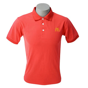 Red polo shirt with McDonald's logo on a mannequin against a white background