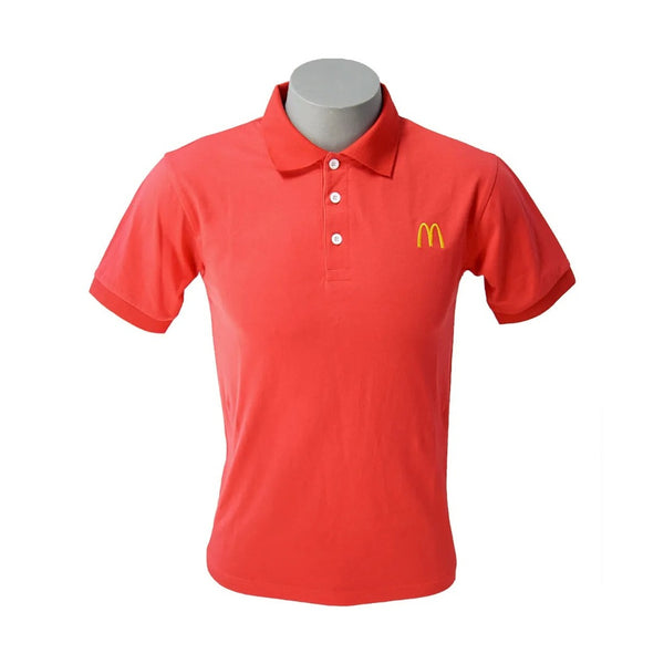 Red polo shirt with McDonald's logo on a mannequin against a white background