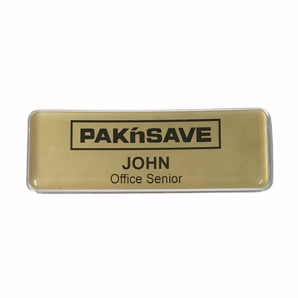 Reusable Gold name badge with Hospitality on a white background. Colin Carr Agencies is a sustainable uniform and accessories specialist.