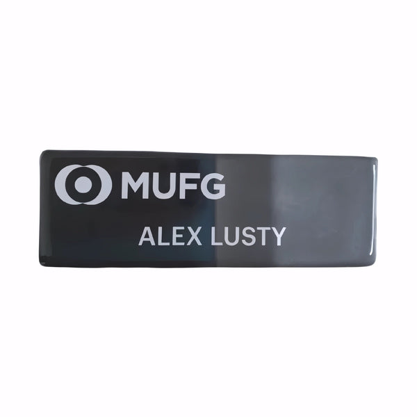 Reusable Black name badge for, conferences, Hospitality and Retail on a white background. Colin Carr Agencies is a sustainable uniform and accessories specialist.