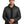 Man wearing a black puffer jacket on a white background - Colin Carr Agencies uniform specialist - Colin Carr Agencies – Spécialiste des uniformes professionnels