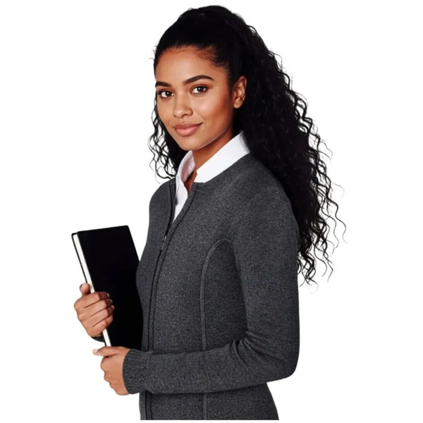 Woman in a gray blazer holding a black folder on a white background