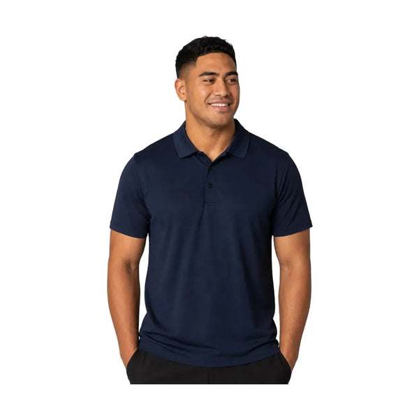 Pacific Island male wearing a navy P815MS short sleeve polo shirt front view with modern fit and clean studio background.
